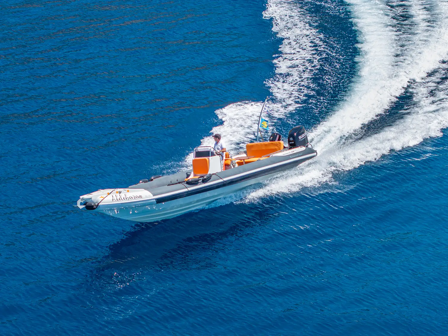 Captain Yiannis Konstantatos, a Merchant Marine Officer, piloting a high-performance RIB boat in Kefalonia